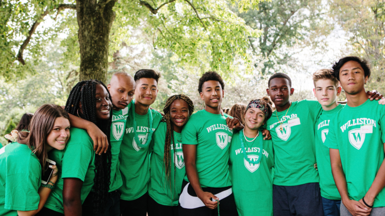 A group photo of Williston students wearing green Williston t-shirts