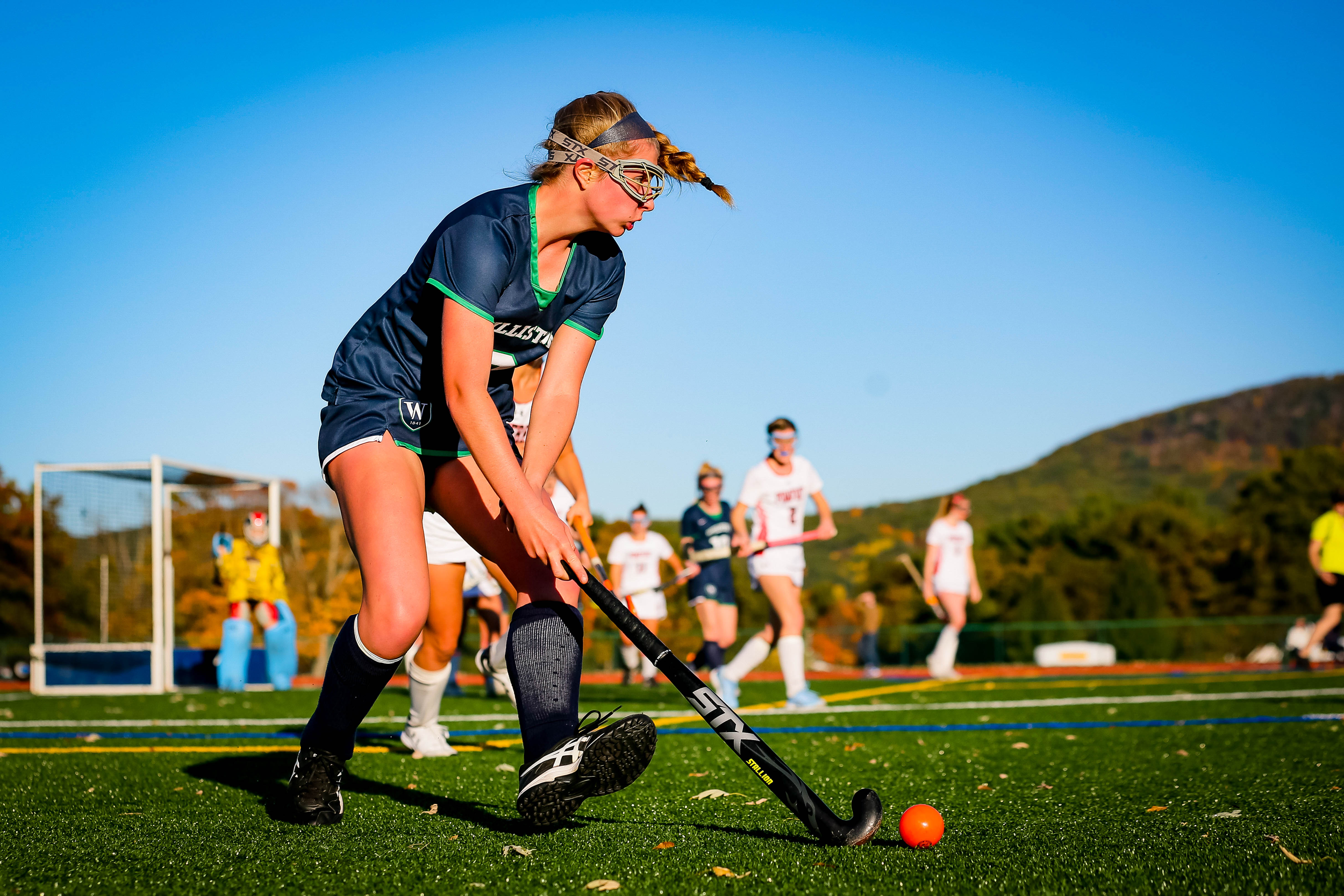 A close up shot of a Williston field hockey player during a match